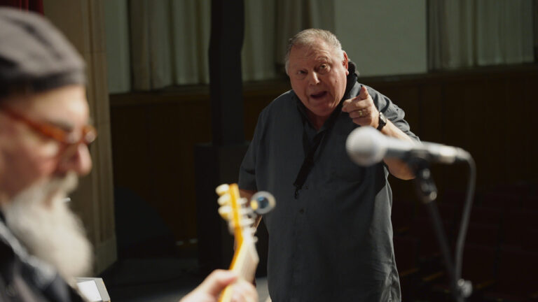 Joe Sielski conducting the musicians for Banded Together: The Boys From Glen Rock High documentary