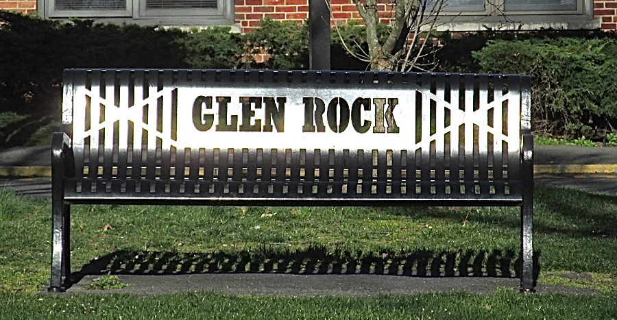 Metal bench with the words Glen Rock